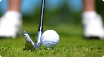 golf ball on tee, ready to be hit