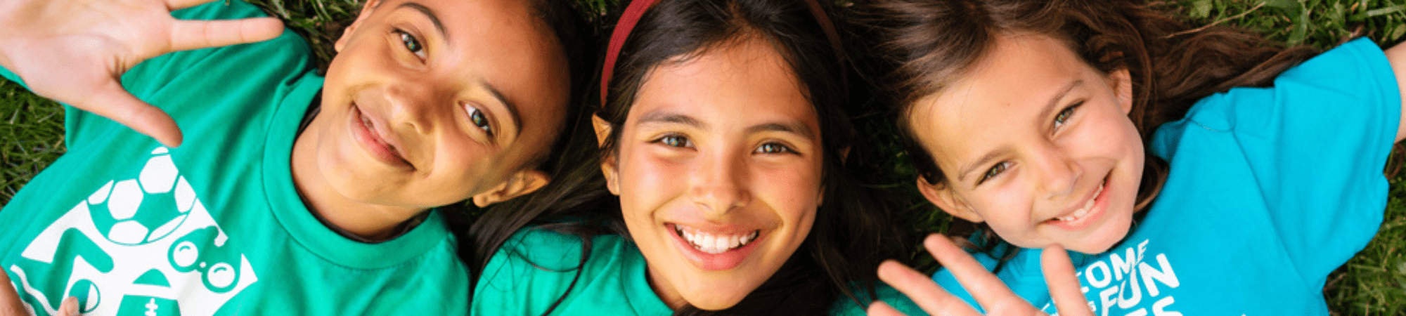 YMCA girls posing on ground