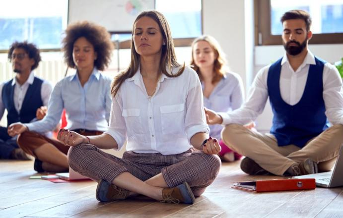 Group of workers meditating